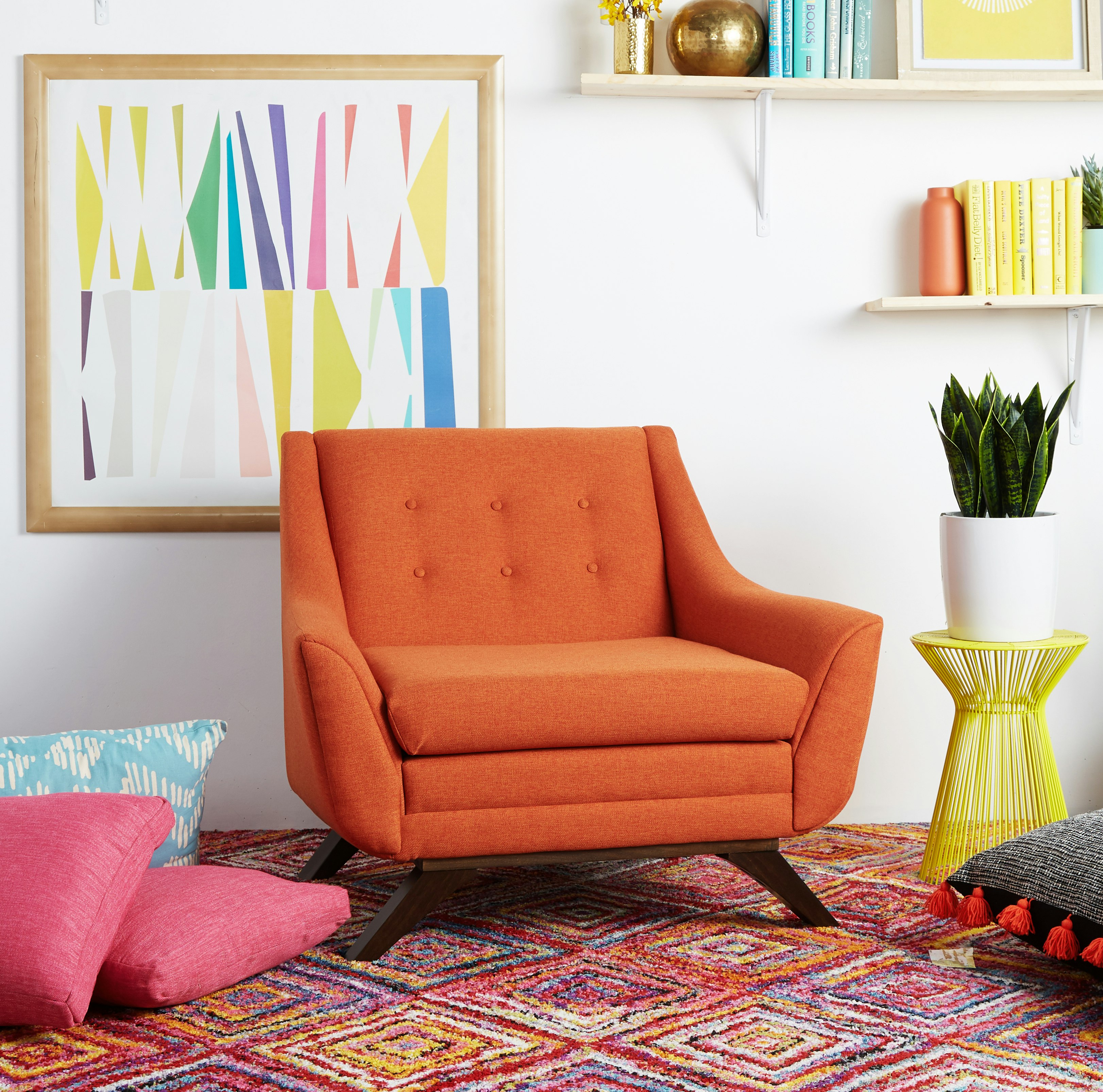 Retro Mid-Century vibes are on full display with the Aubrey Collection's sloped arms, angled legs and button tufted backings.