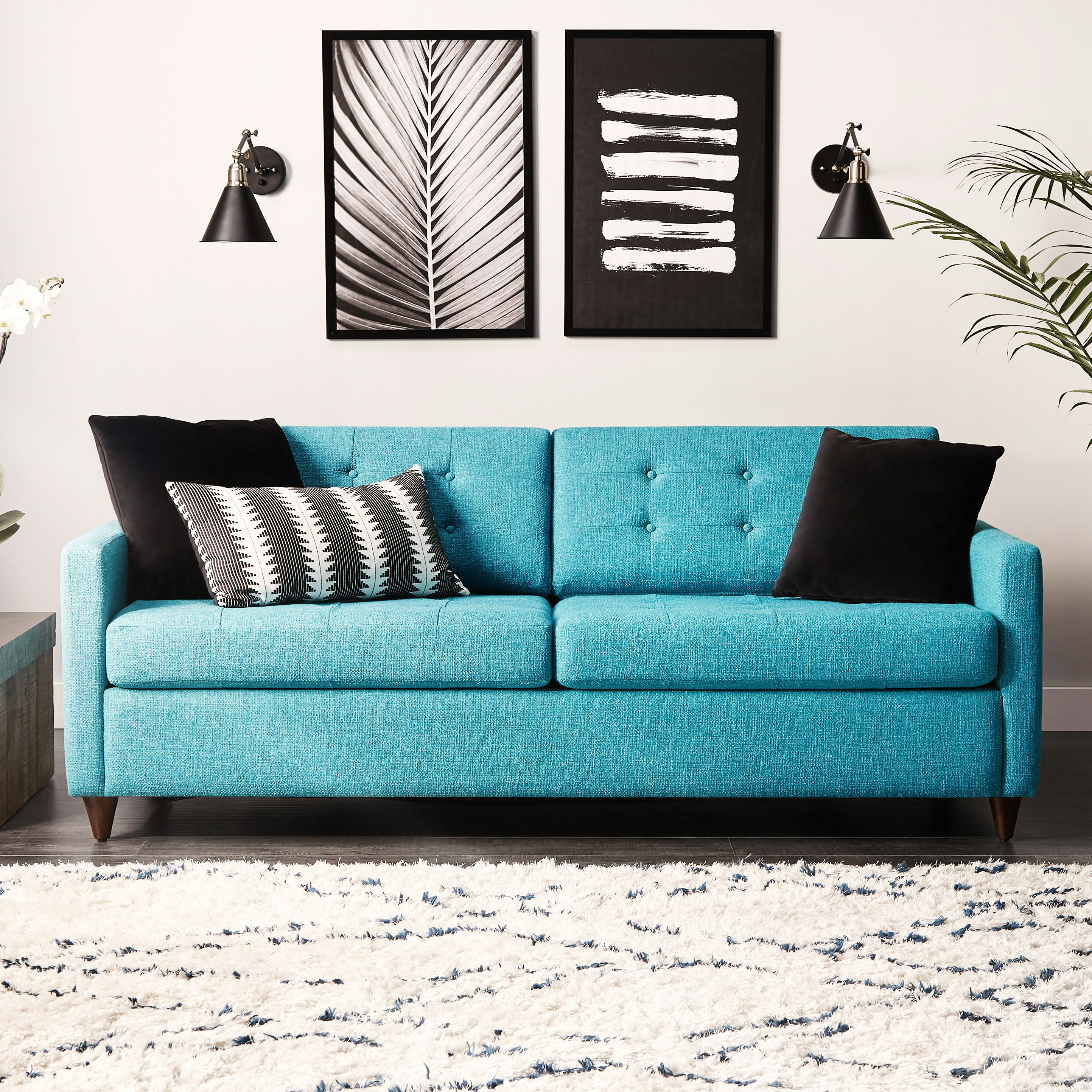 Sleek Mid-Century lines and tufted button detailing gives this collection a timeless, polished look.