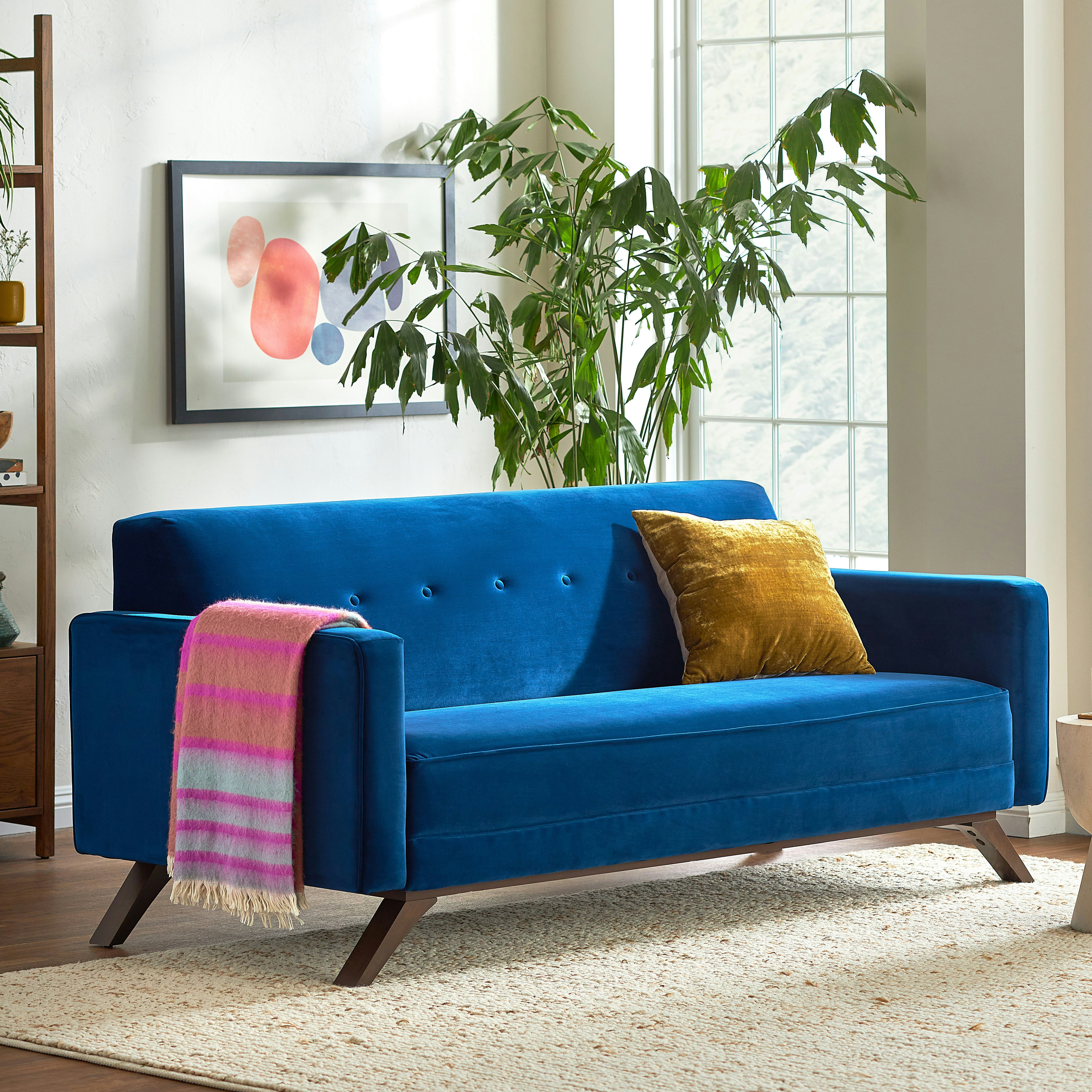 Refreshingly retro, the Roddy Collection features classic mid-century modern lines, button tufting, and striking diagonal legs.